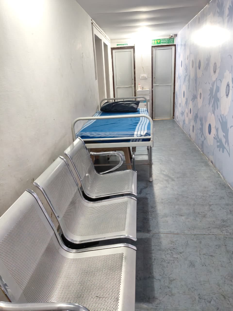 Patient bed and seating in the rest corridor at Uchit Diagnostic