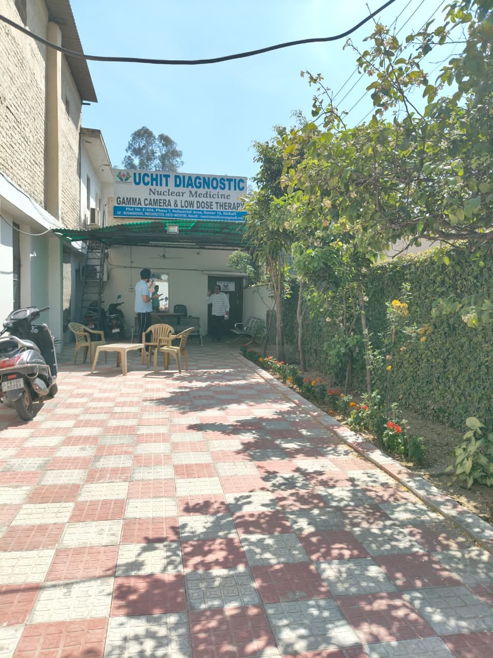 Uchit Diagnostic entrance signboard and paved courtyard in Phase 7, Mohali
